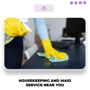 A cleaner wearing yellow gloves spraying and wiping a desk surface for Hightower Private Housekeeping in Henderson, NV.