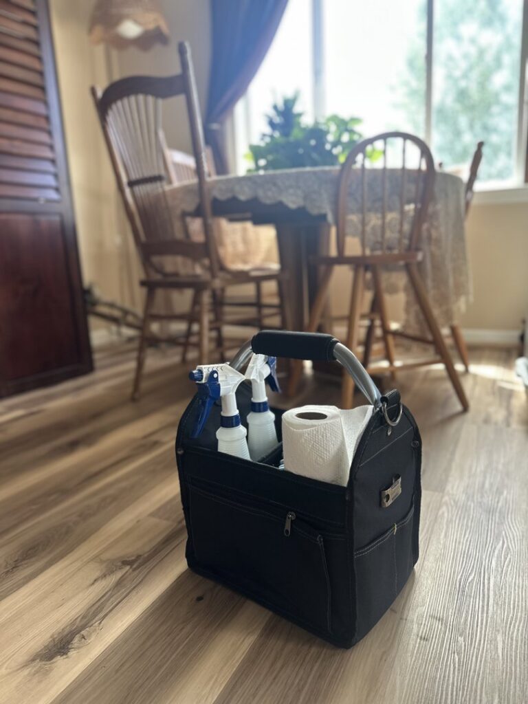 A cleaning caddy filled with supplies on a clean floor, ready for house cleaning by Deschutes Cleaning in Bend, OR.