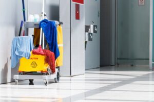 A professional cleaning cart with mop, bucket, and supplies ready for service by Le Fine Cleaning in South Bend, IN.