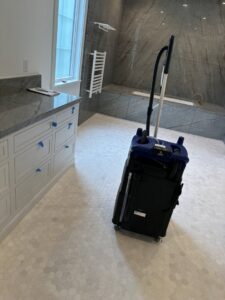 A professional cleaning machine positioned in a bathroom, ready for deep cleaning services by Simply Clean Jax in Jacksonville, FL.