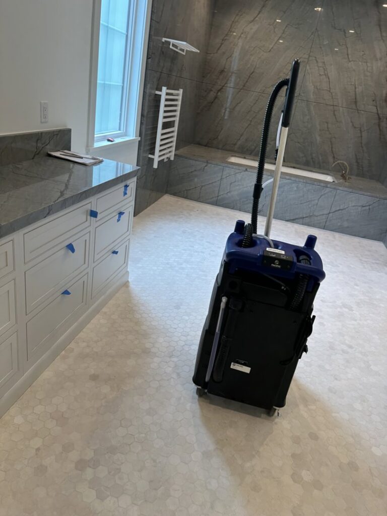 A professional cleaning machine positioned in a bathroom, ready for deep cleaning services by Simply Clean Jax in Jacksonville, FL.