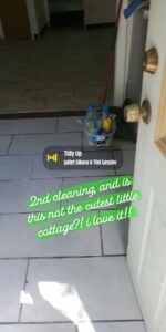 Cleaning supplies placed at the doorway of a cottage, indicating a house cleaning job by Make It Shine in Worcester, MA