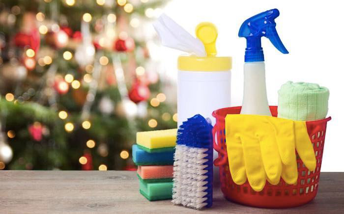 A collection of cleaning supplies, including sprays, sponges, and gloves, ready for holiday cleaning by Shining Light Care Services in Fort Wayne, IN.