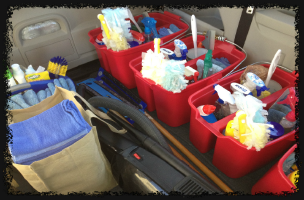 Organized cleaning supplies in red buckets ready for a house cleaner job by Choice Cleaning in Franklin Township, Indianapolis, IN.