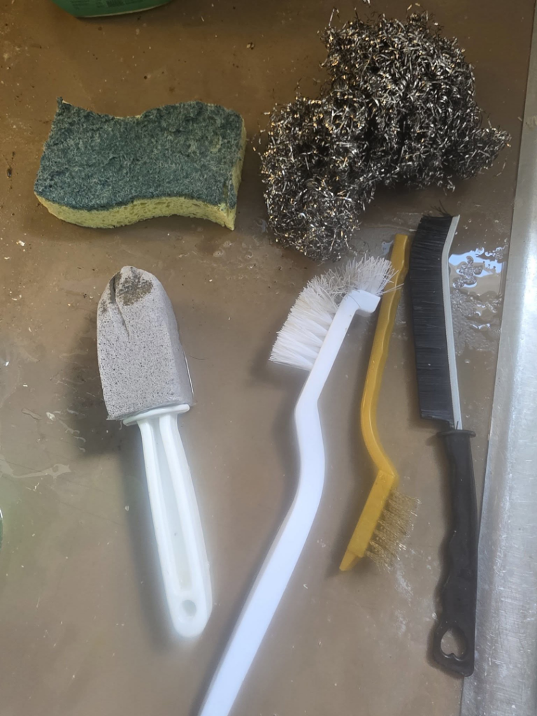 A collection of cleaning tools and supplies used by Clemons Cleaning service LLC in Jackson, MI.