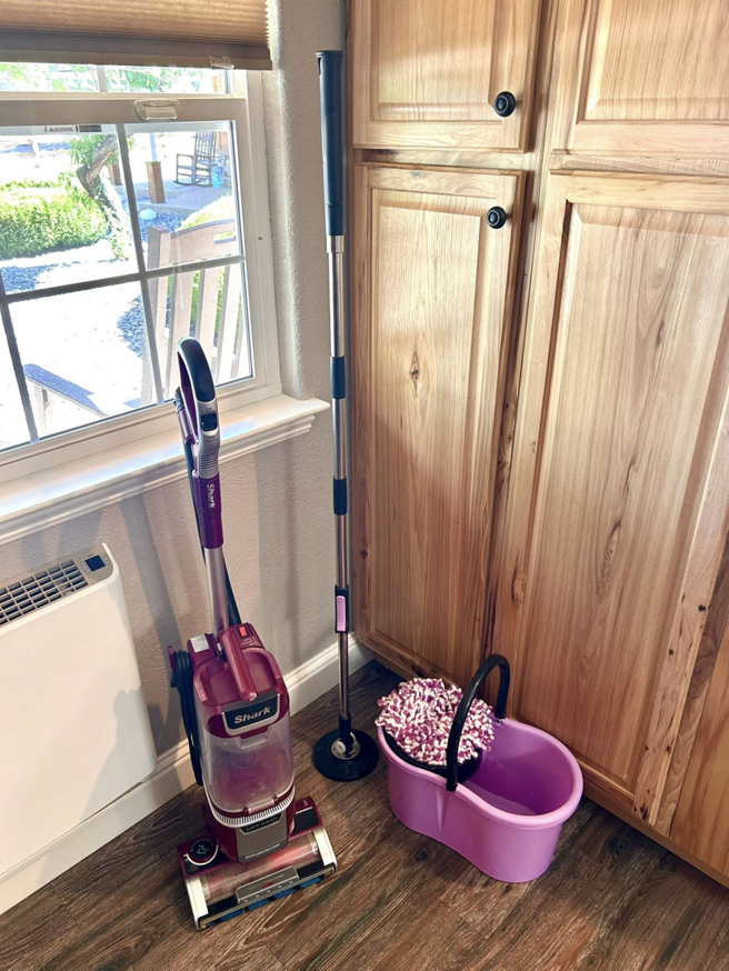 Professional cleaning tools including a vacuum, mop, and bucket, ready for use by Wendy's Magic Cleaning in Reno, NV.
