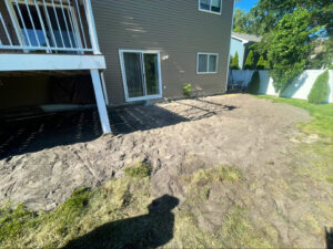 A cleared backyard site after concrete removal by Rick's Demolition and Concrete Removal in Minneapolis, MN