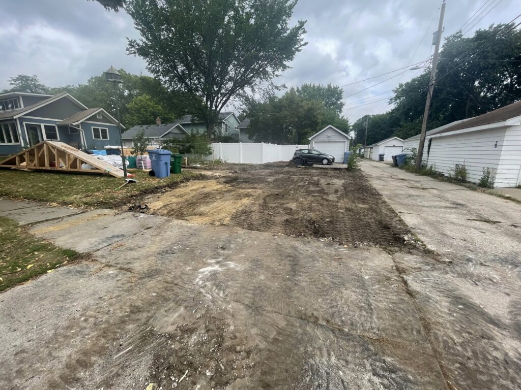 A cleared demolition lot in a residential area by Rick's Demolition and Concrete Removal in Minneapolis, MN