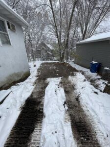 A cleared path with heavy machinery tracks after demolition or site clearing by Rick's Demolition and Concrete Removal in Minneapolis, MN