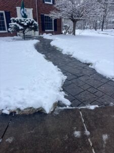 A cleared pathway after snow removal service by Snow Scholars - Snow Removal By College Students in Madison, WI.