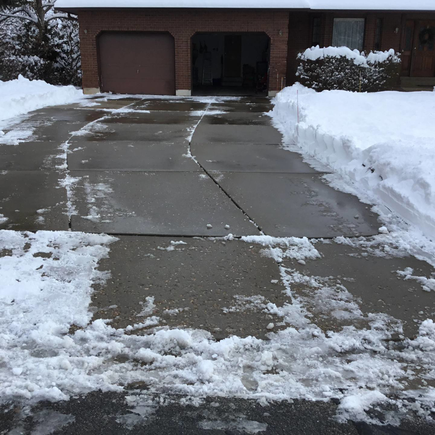 A completely cleared residential driveway after professional snow removal by JJ'S Lawn And Tree Services in Atlanta, GA.