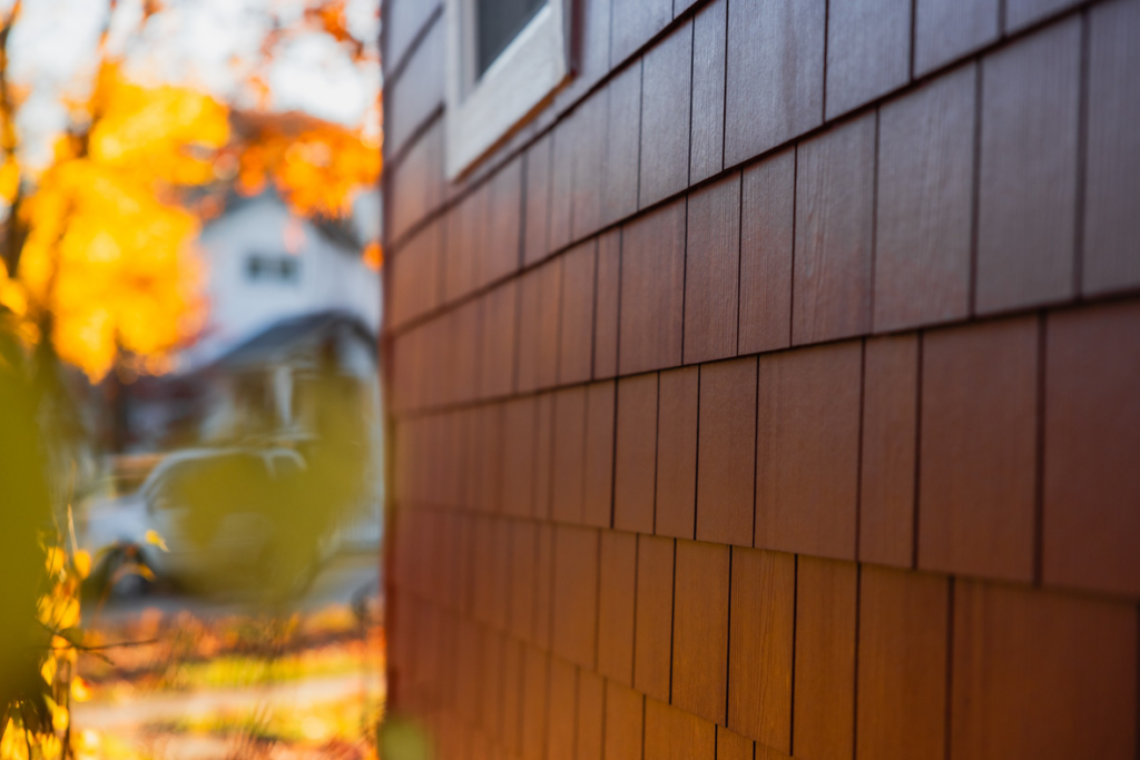 Close-up view of beautiful brown shingle-style siding installed by Ideal Siding Nashville, TN.