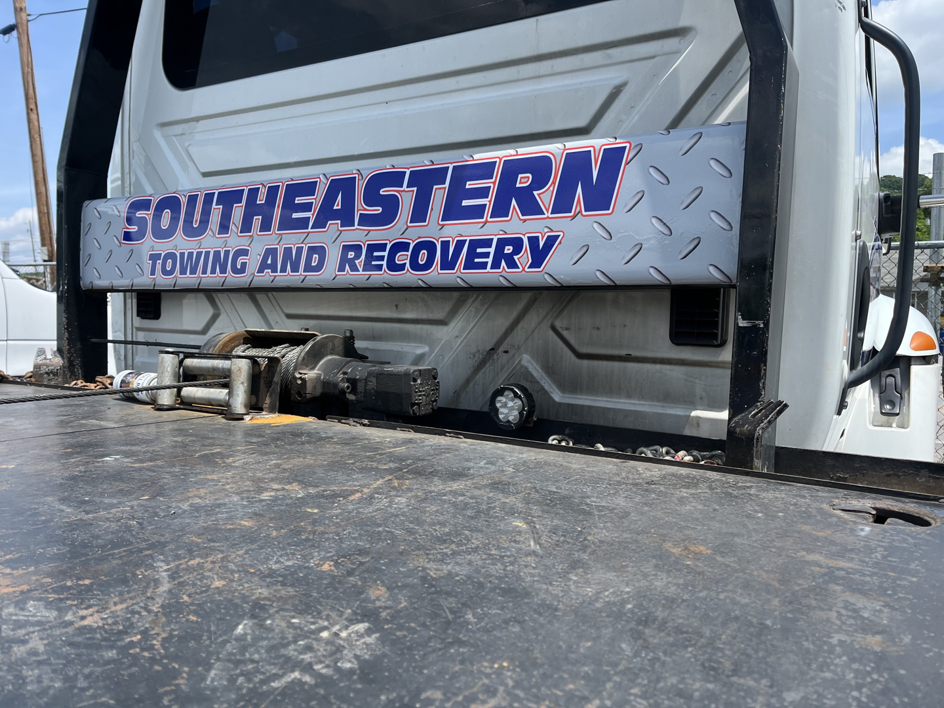 Close-up of a tow truck's winch and flatbed equipment at Southeastern Towing Inc. in Chattanooga, TN.