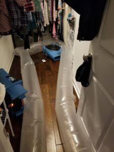 Water damage drying equipment with inflatable ducts in a closet by ABC Cleaning and Restoration in Harvest, AL.