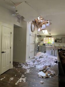A residential interior with a collapsed ceiling and insulation, indicating water damage handled by Central Oregon Disaster Restoration in Bend, OR.
