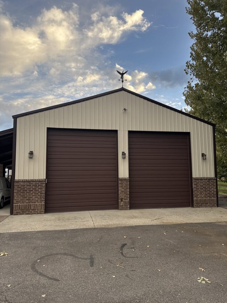Two brown roll-up garage doors installed on a commercial building, showcasing work by Right Choice Doors in Layton, UT.