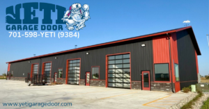 A commercial building featuring multiple modern glass garage doors installed by YETI Garage Door in Moorhead, MN.