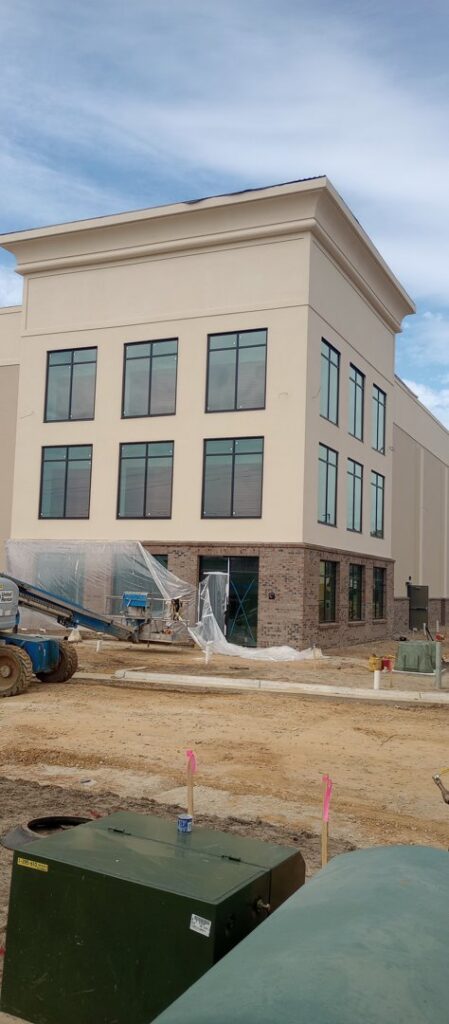 Commercial building under construction with stucco, EIFS, and brick siding by Eastern Stucco Restorations in Rock Hill, SC.
