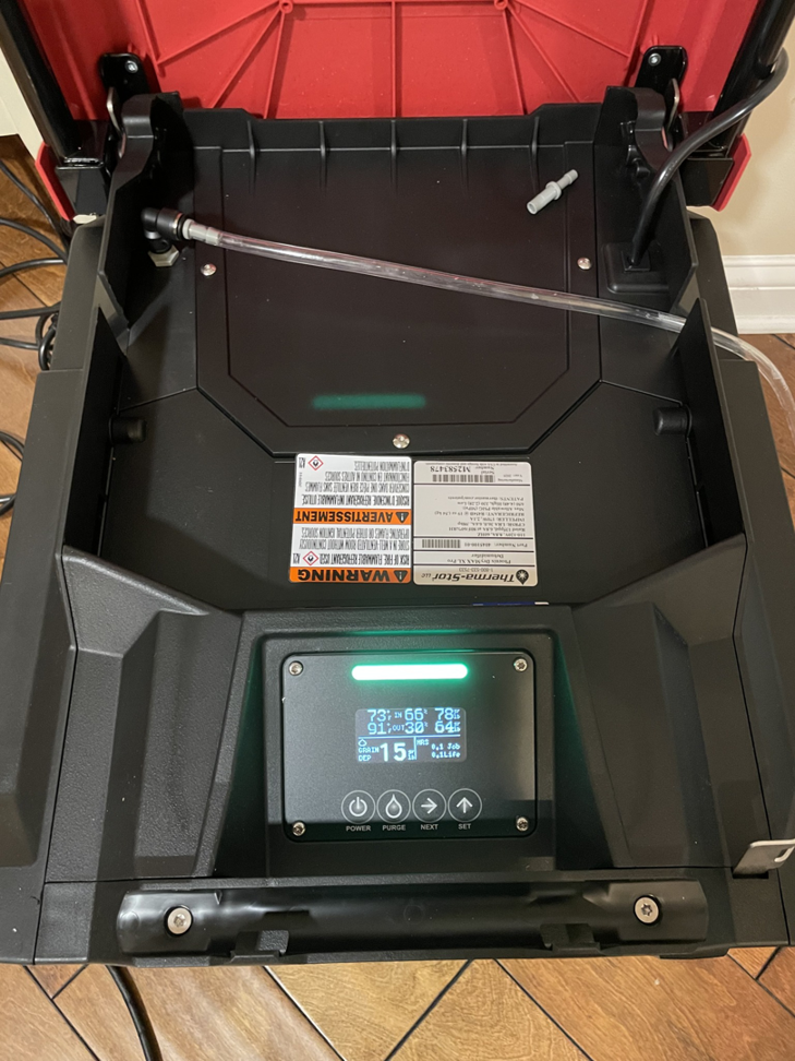 A commercial dehumidifier with a digital display used for water damage drying by Healthy Interior Solutions in Fishers, IN.