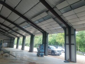 Interior view of a commercial building with multiple overhead garage doors installed by Overhead Door Company of Little Rock in North Little Rock, AR.