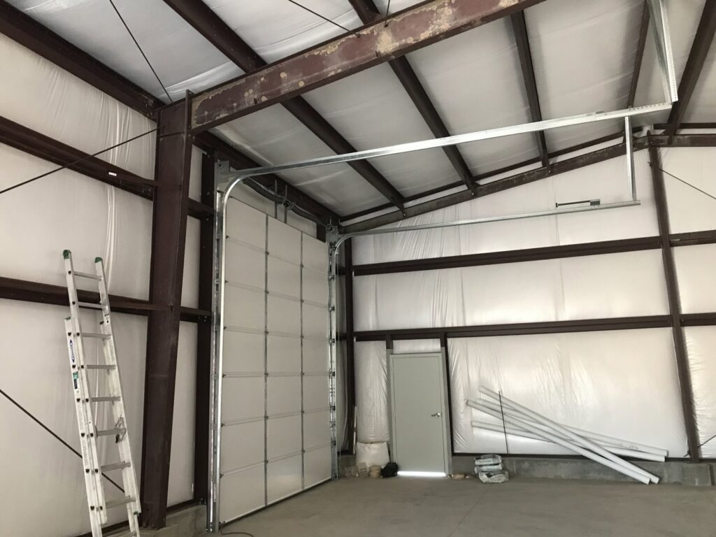 Interior view of a commercial garage door installation by Up N Over Garage Doors LLC in Layton, UT.