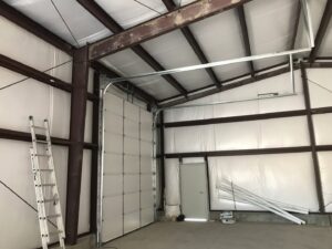Interior view of a commercial garage door installation by Up N Over Garage Doors LLC in Layton, UT.