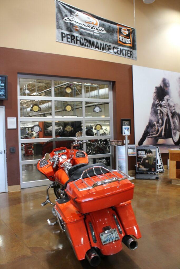 A commercial glass garage door in a motorcycle dealership installed by Valley Overhead Door in Las Vegas, NV.