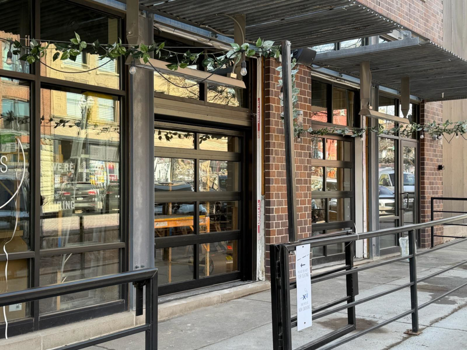 Commercial glass garage doors installed on a building by Garage Door Services, Inc. in Omaha, NE.