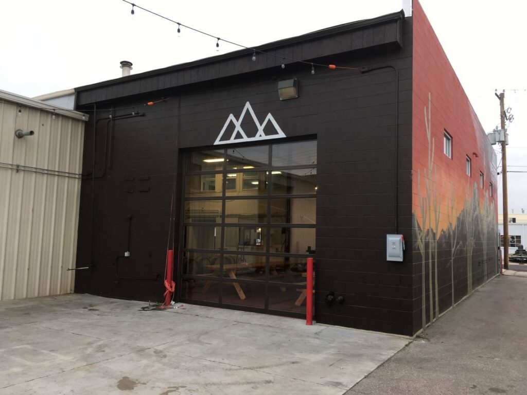 Large glass garage door installed on a commercial building by Garage Door Store Boise, ID.