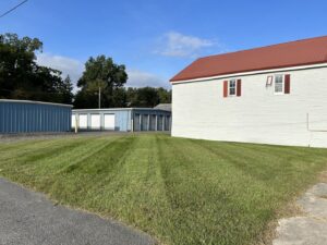 A commercial property's lawn neatly mowed with stripes, showcasing services by A & J Lawn Care LLC in Seaford, DE.