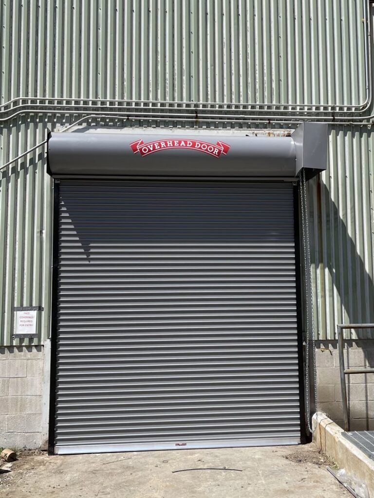 A commercial rolling steel door with the Overhead Door logo, installed by Overhead Door Company of Little Rock in North Little Rock, AR.