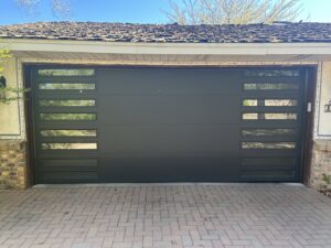 Two dark gray rolling steel doors installed on a commercial building by Wayne Dalton Sales & Service of Albuquerque, NM