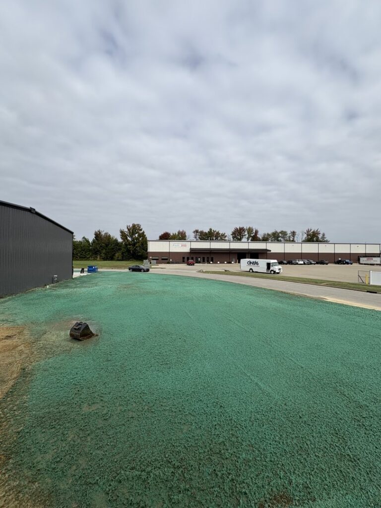 A large commercial parking lot covered in snow, indicating a recent snow removal job by Elpers Lawn Service and Landscapes in Evansville, IN.