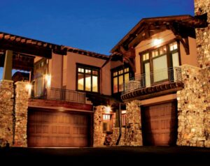 A large white commercial sectional garage door, partially open, installed by Wayne Dalton Sales & Service of Albuquerque, NM