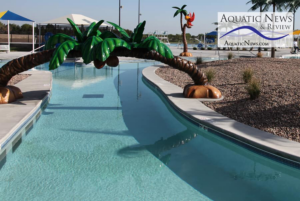 A beautifully completed lazy river style pool with artificial palm trees, showcasing work by ACL Consultant in Edmond, OK