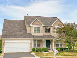 A completed siding installation on a two-story home by Legend Exteriors & Construction in West Chicago, IL