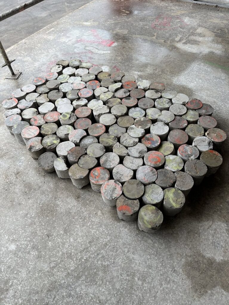 A collection of concrete core samples, often taken during demolition or structural analysis by Valute Demolition in Jacksonville, FL.