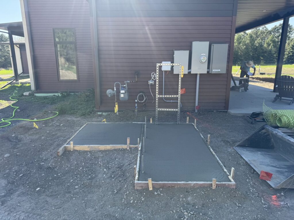 Concrete pad installation in progress for a pool project by Backyard Escapes by Kerner Pools & Spas in Bismarck, ND.