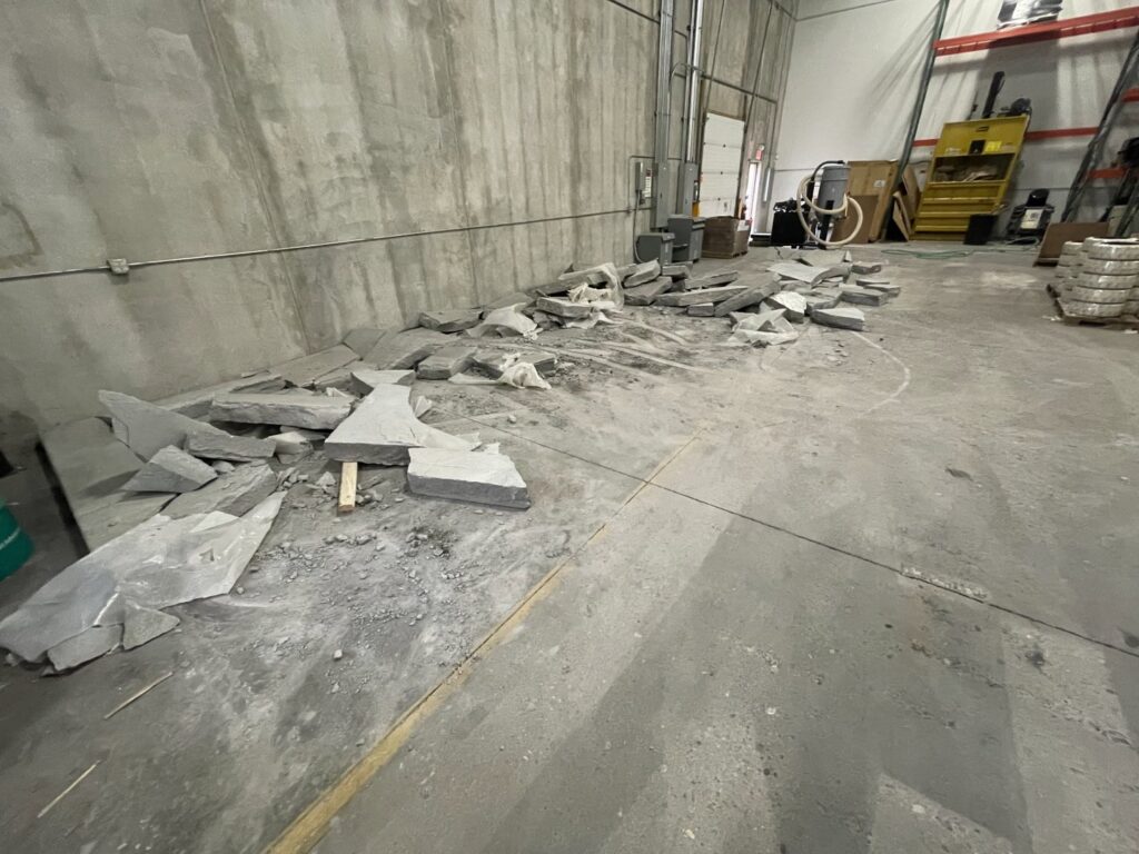 Broken concrete slabs removed from an industrial space by Rick's Demolition and Concrete Removal in Minneapolis, MN
