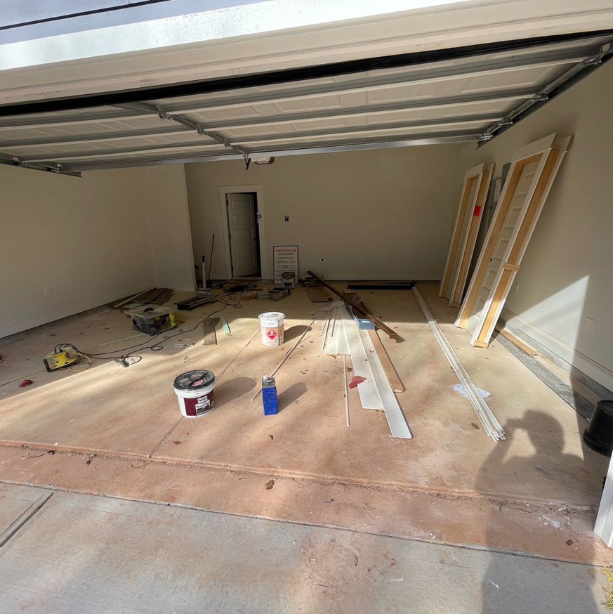Construction debris and renovation waste being removed from a garage by Athens Pressure Washing Services in Athens, GA.