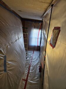 A contained area with plastic sheeting set up for mold or water damage remediation by AdvantaClean of Cabarrus and Rowan Counties in Concord, NC.