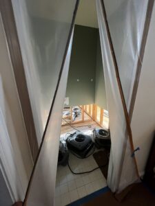 A contained area with drying equipment visible, indicating water damage restoration work by Remont Restoration in Hagerstown, MD.