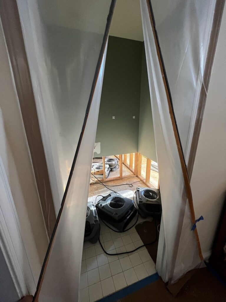 A contained area with drying equipment visible, indicating water damage restoration work by Remont Restoration in Hagerstown, MD.