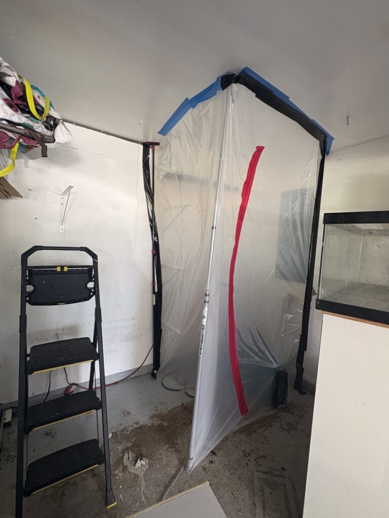A plastic containment area set up for mold or water damage remediation by Catalyst Restoration in Hagerstown, MD.