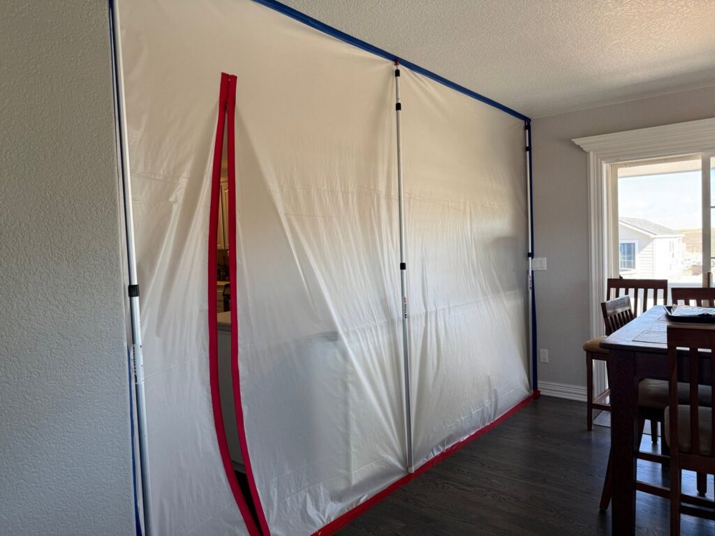 A plastic containment barrier installed for water damage remediation by Property Doctors, Inc. in Denver, CO.