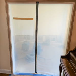 A plastic containment barrier with a zipper entrance set up for water damage restoration by Remont Restoration in Hagerstown, MD.