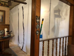Temporary containment barriers set up for water damage restoration by One Stop Dry Out Restoration of Arkansas in a home in North Little Rock, AR.