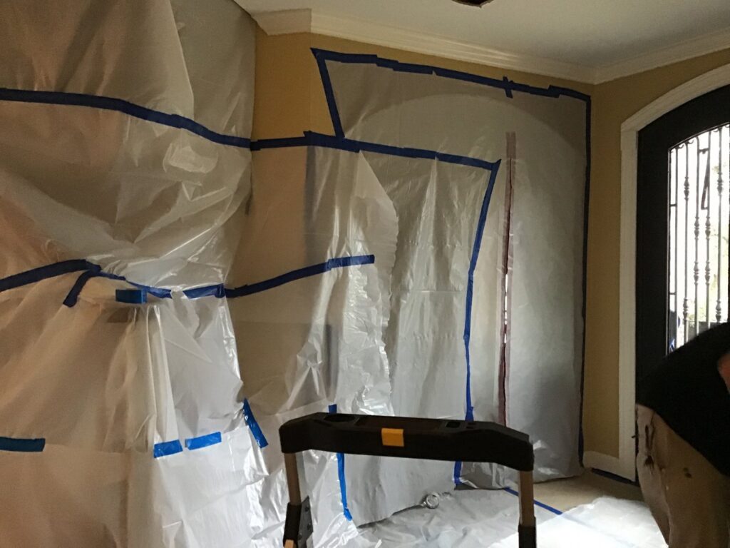 A room sealed with plastic sheeting for containment during water damage or mold remediation by PuroClean of Tuscaloosa in Northport, AL.
