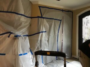 A room sealed with plastic sheeting for containment during water damage or mold remediation by PuroClean of Tuscaloosa in Northport, AL.