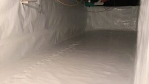 A newly installed vapor barrier in a crawl space by Restored Air, a water damage specialist in Summerville, SC.